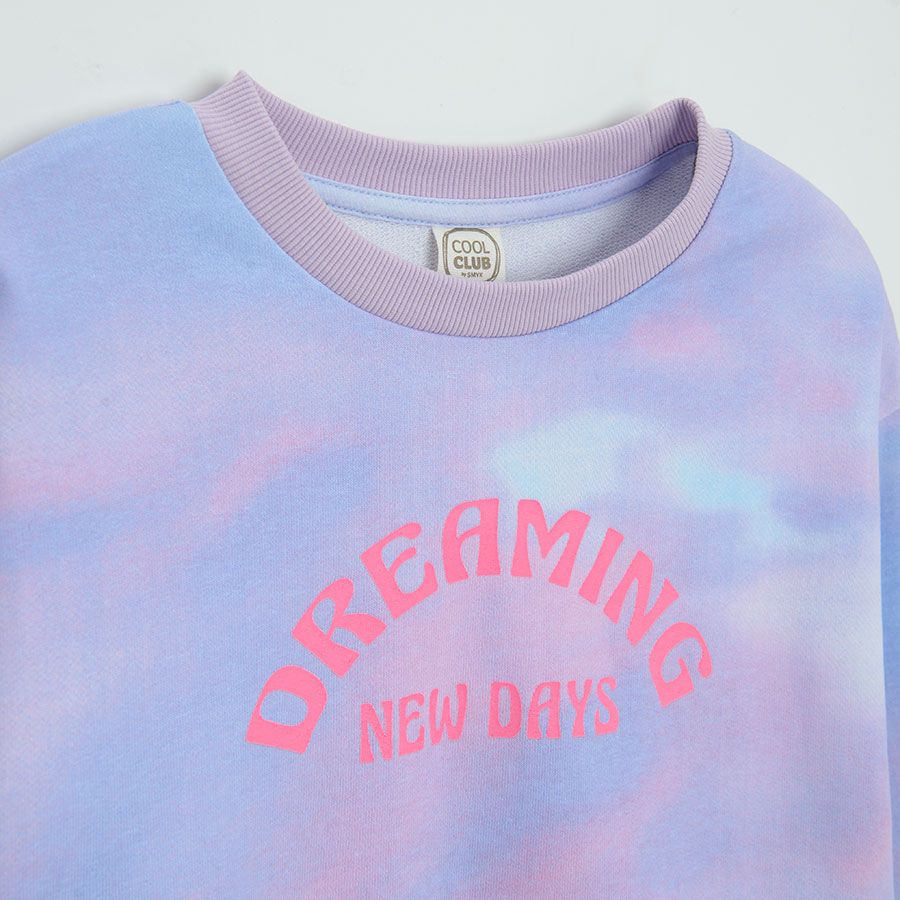 Purple tie dye sweatshirt with DREAMING NEW DAYS print