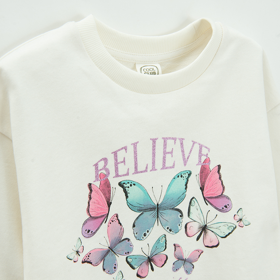 While sweatshirt with butterflies and BELIEVE print
