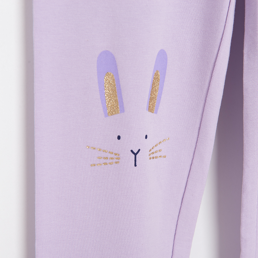 Purple leggings with kitten face print on knees