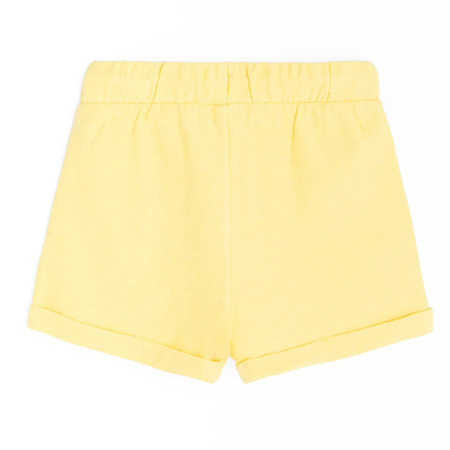 Yellow shorts with cord on the waist