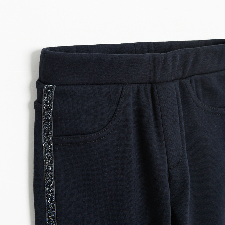 Blue jeggings with gold stripe