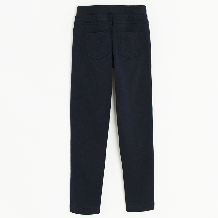 Blue jeggings with gold stripe