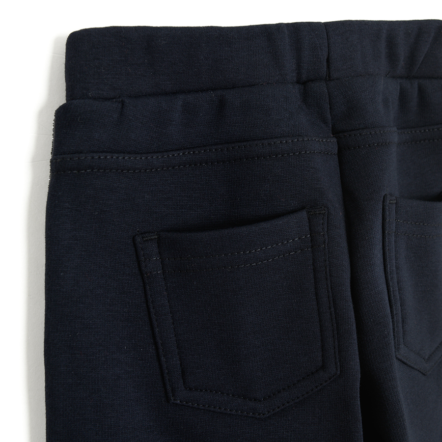 Blue jeggings with gold stripe