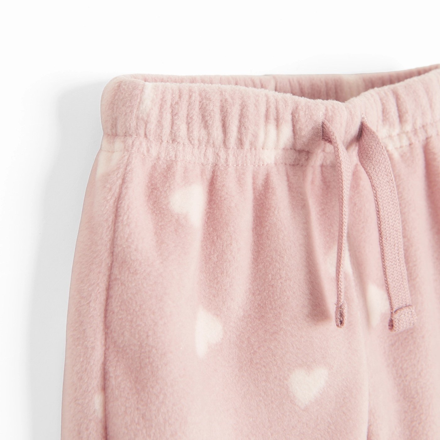Σετ φόρμα 2 τμχ. ζακέτα fleece με φερμουάρ ροζ και παντελόνι φόρμα ροζ με στάμπα καρδούλες
