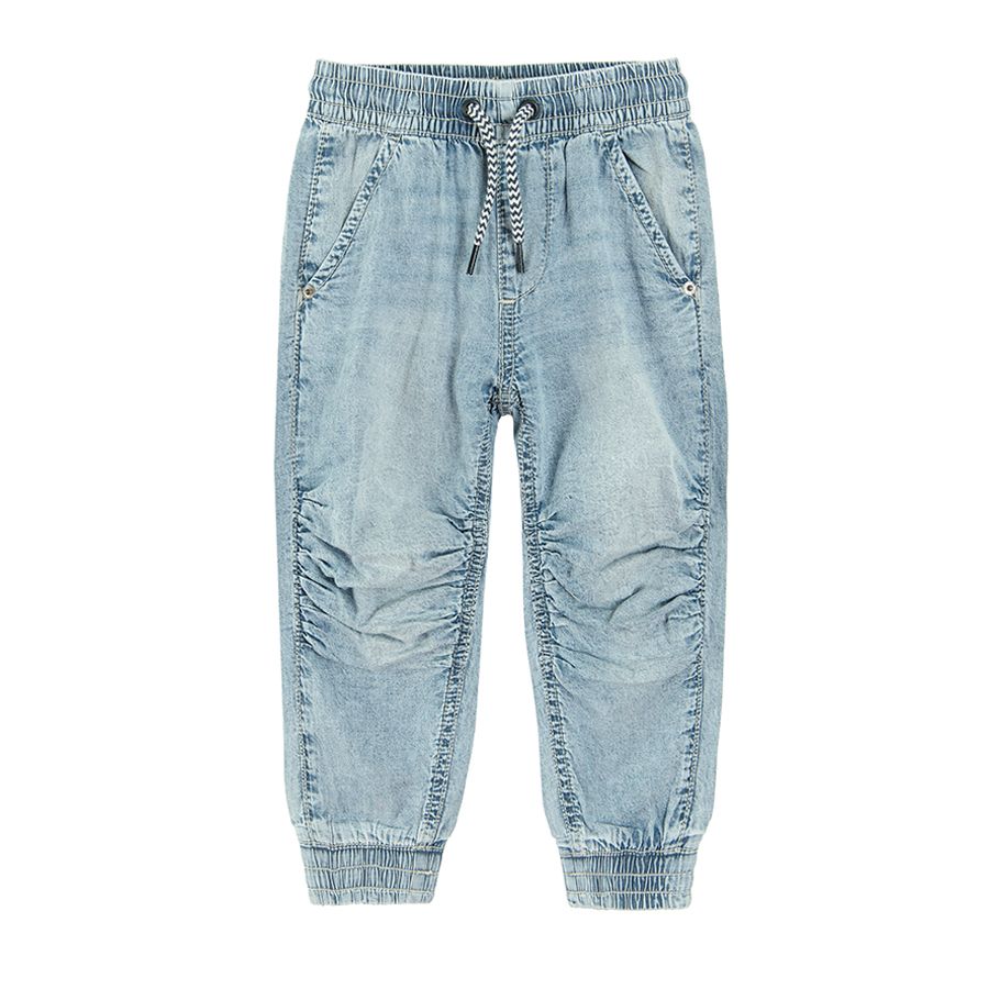 Denim trousers with cord and elastic band around the ankles