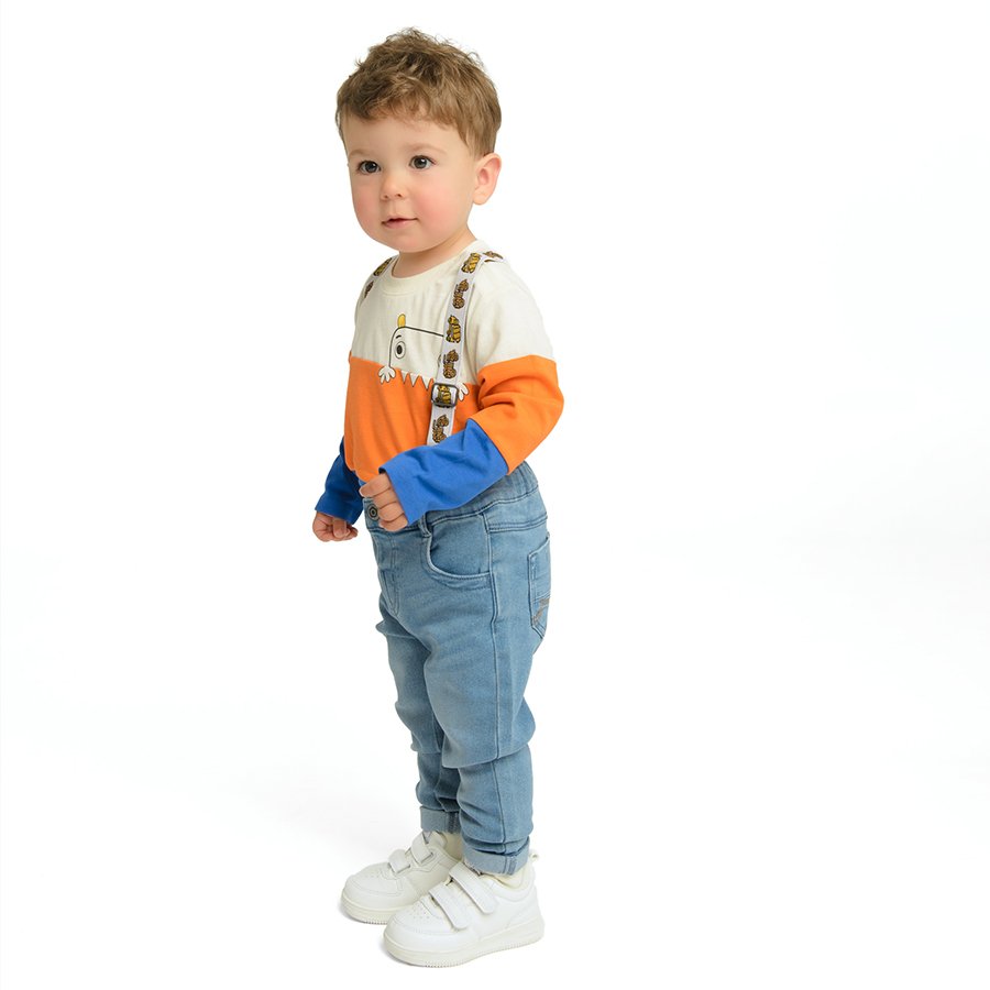 Denim pants with decorative straps