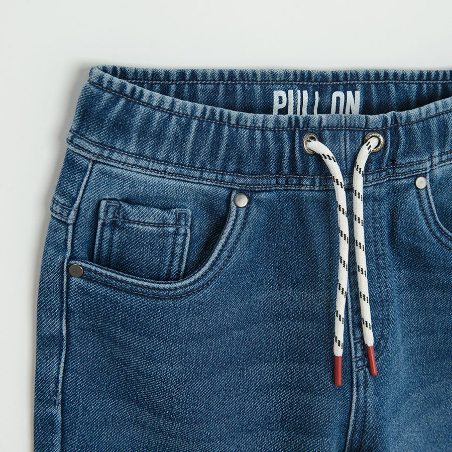 Dark blue denim with cord in the waist