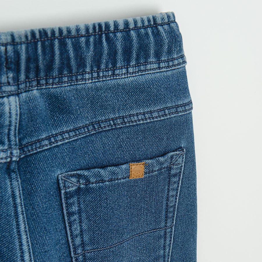 Dark blue denim with cord in the waist