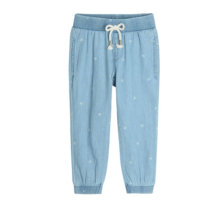 Denim trousers with elastic waist and ankles with leaves print