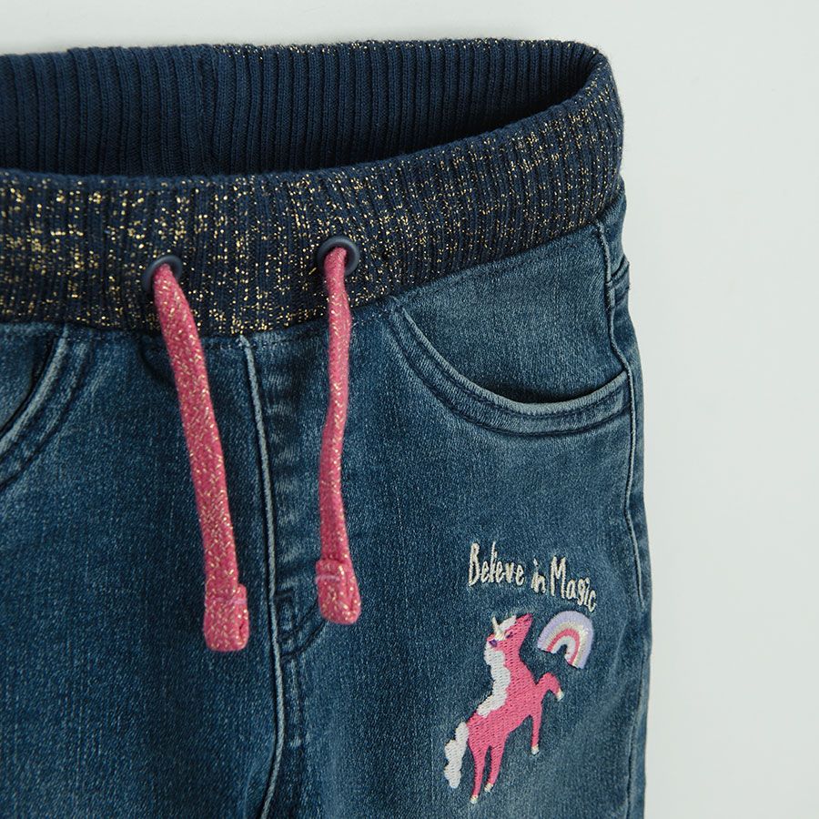 Denim pants with unicorn print and pink lining