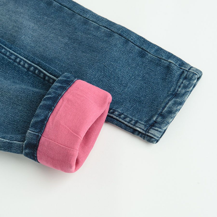 Denim pants with unicorn print and pink lining