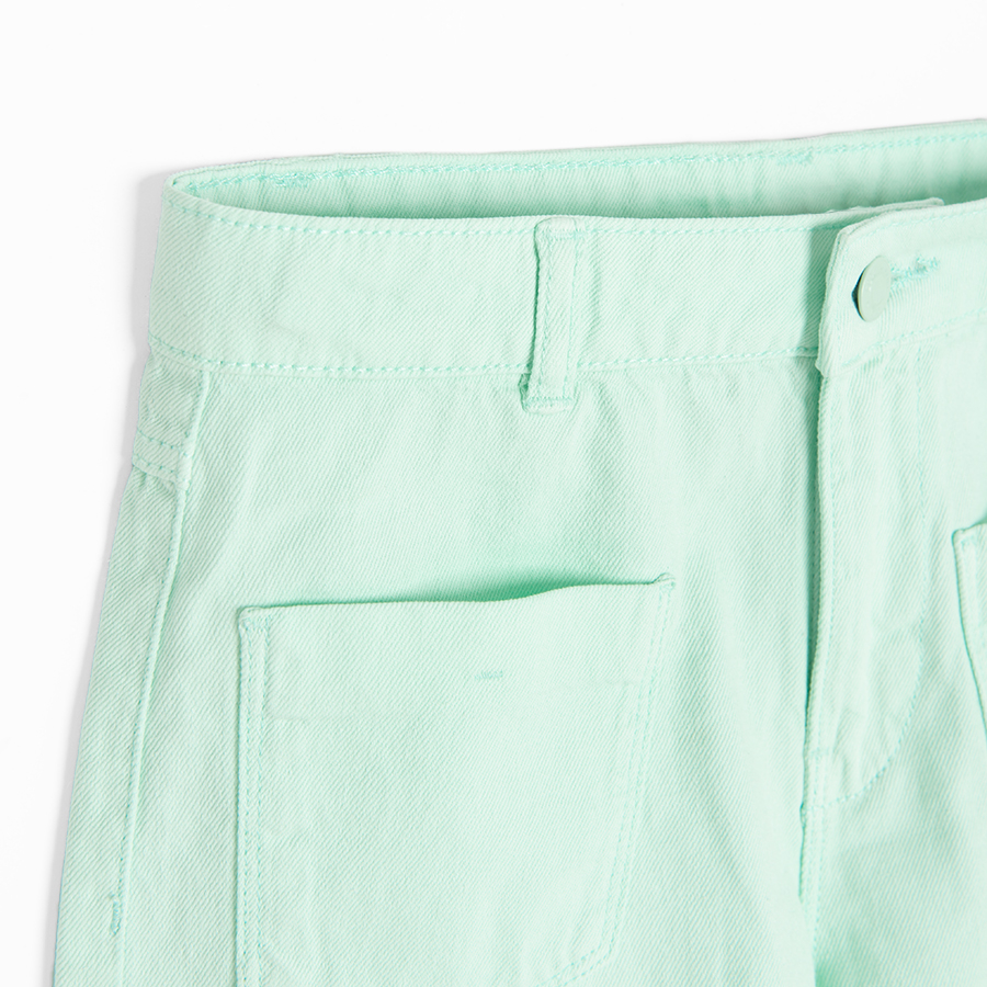 Turquoise denim shorts with back pockets on the front