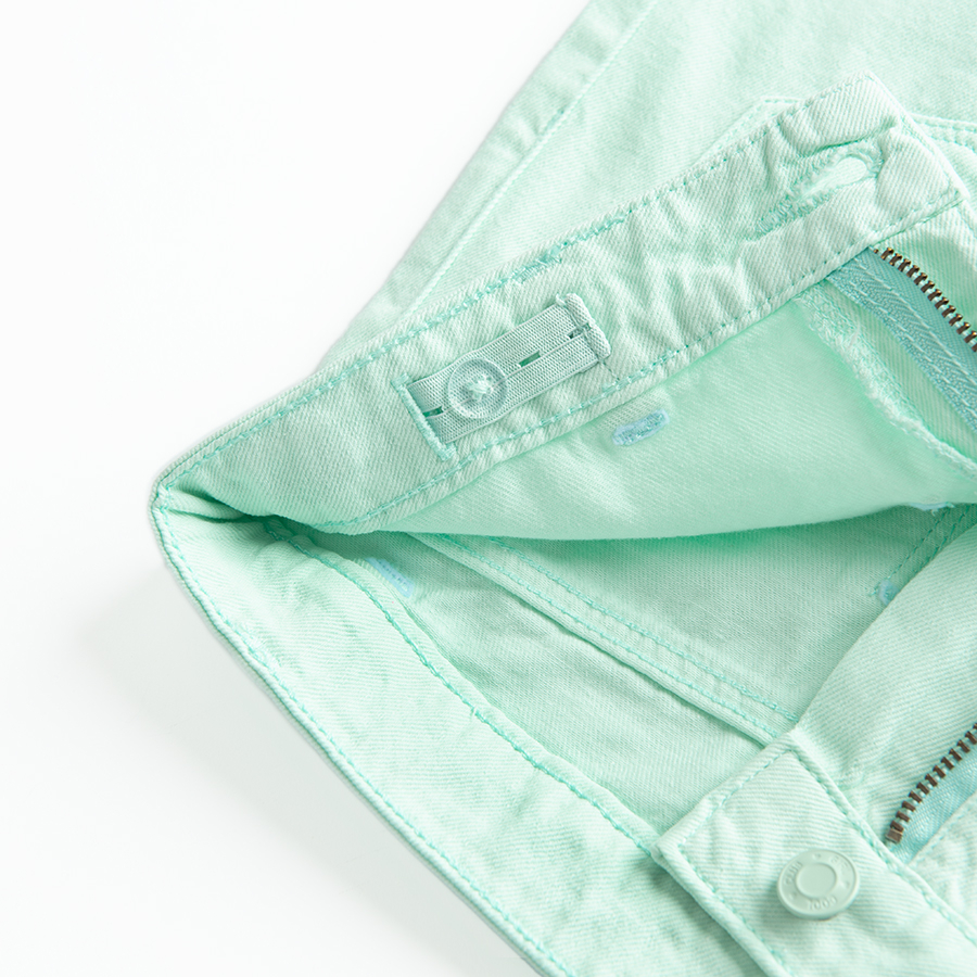 Turquoise denim shorts with back pockets on the front