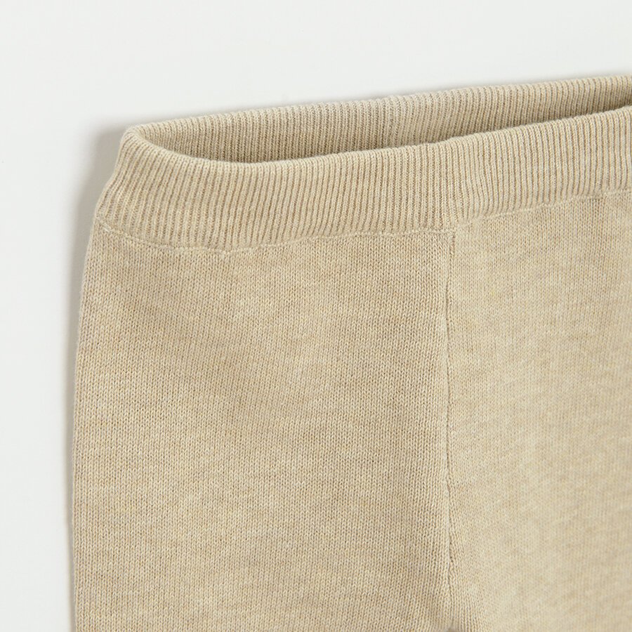Ecru footless leggings with bear face on the knees