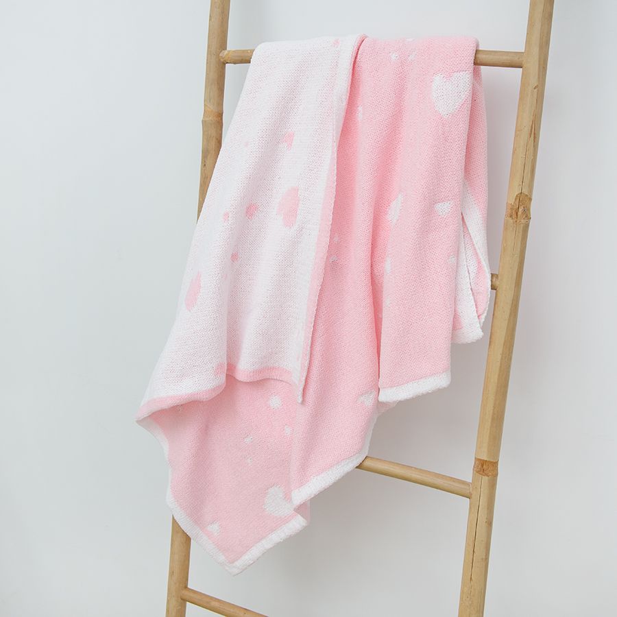 Pink blanket with hearts print