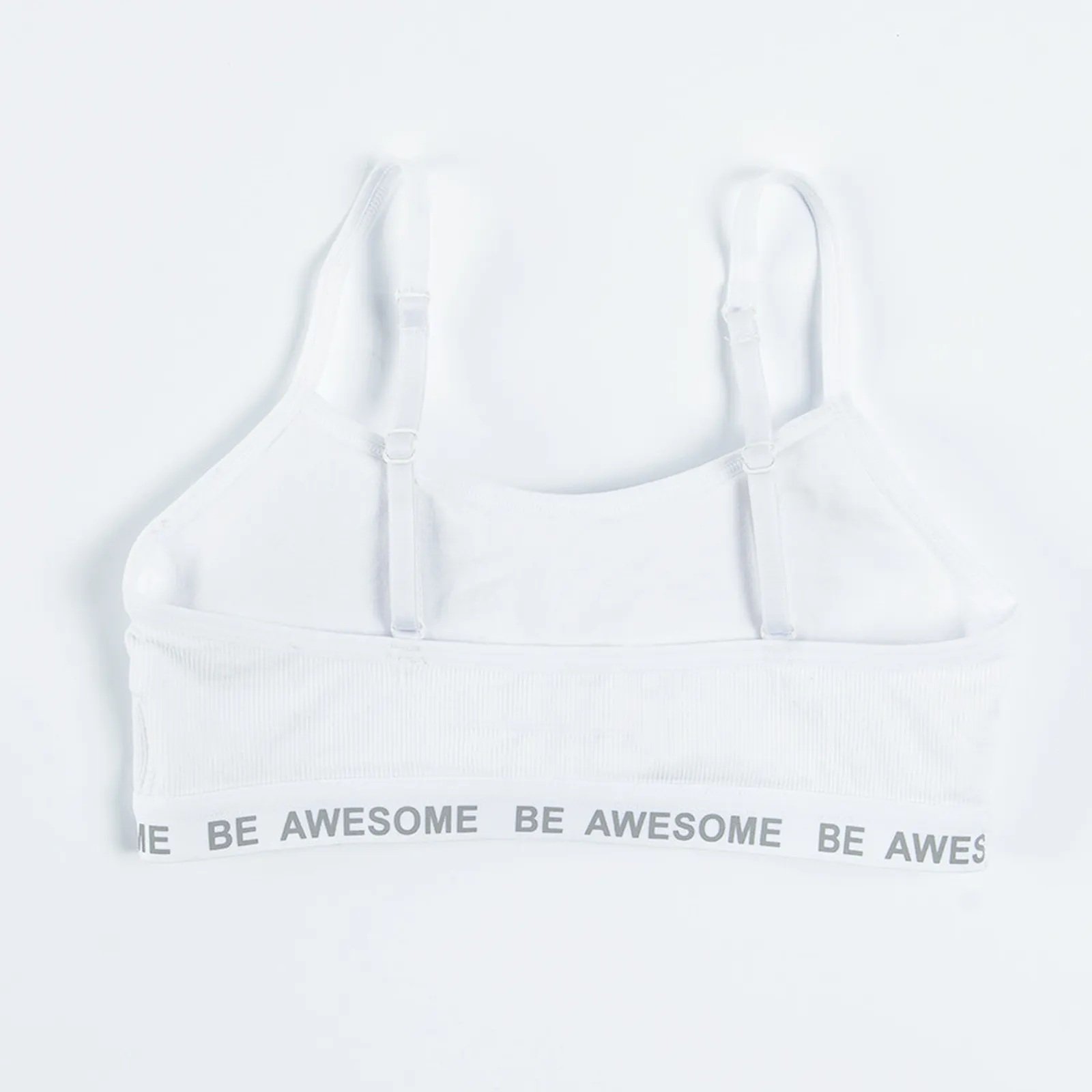 White and black bras with Be awesome print on the elastic band